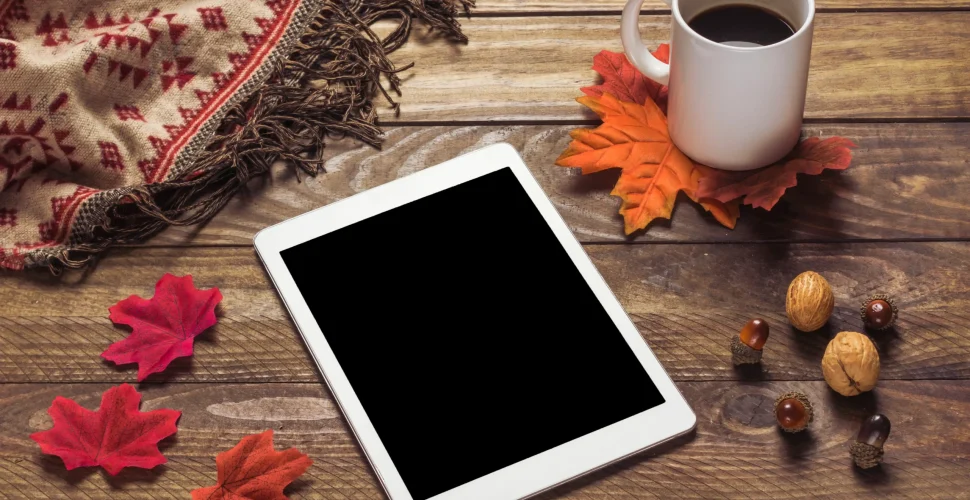 tablet-blanket-near-leaves-coffee